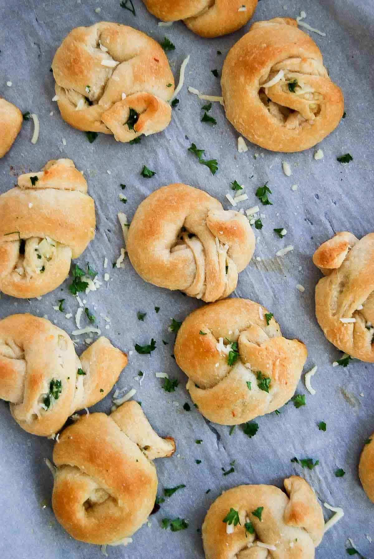 crescent roll garlic knots on baking tray.