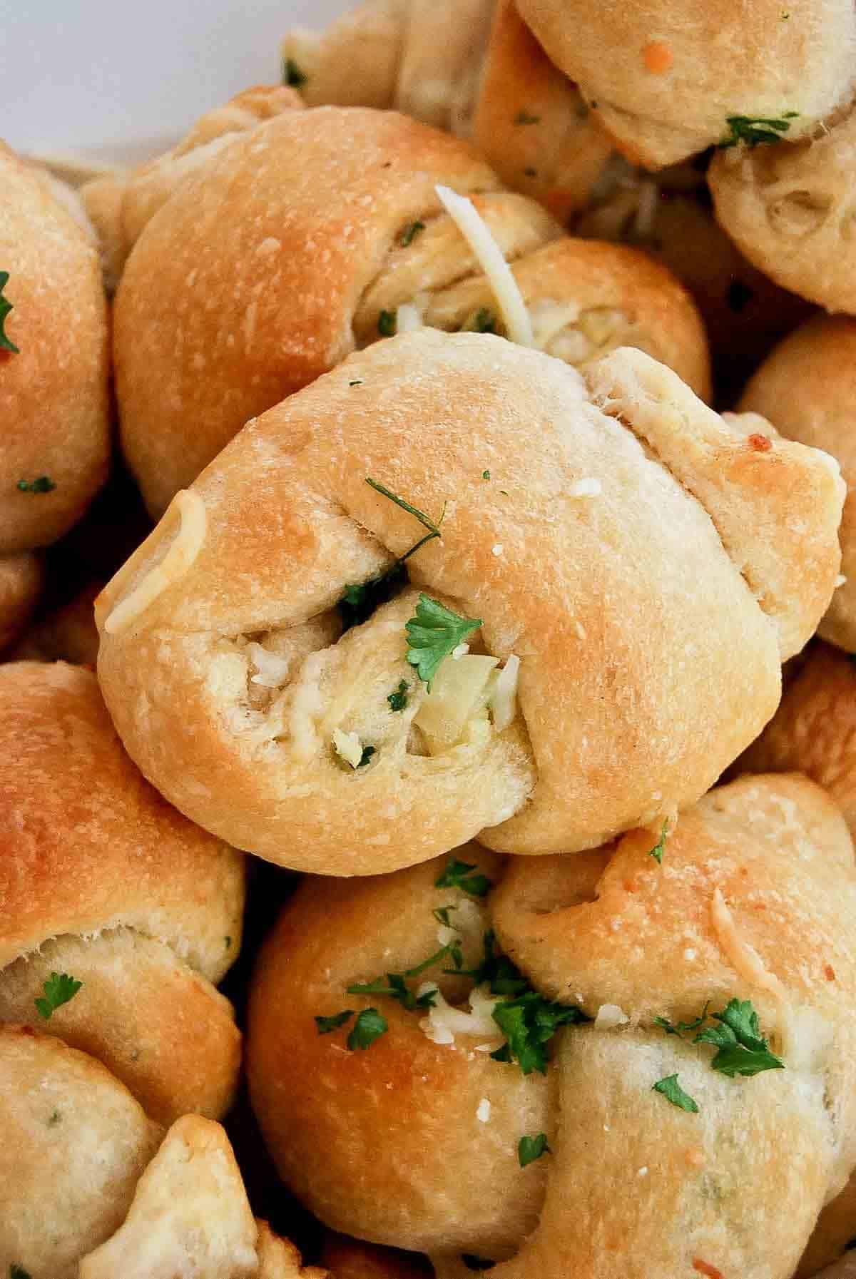 closeup of cheesy crescent roll garlic knots.