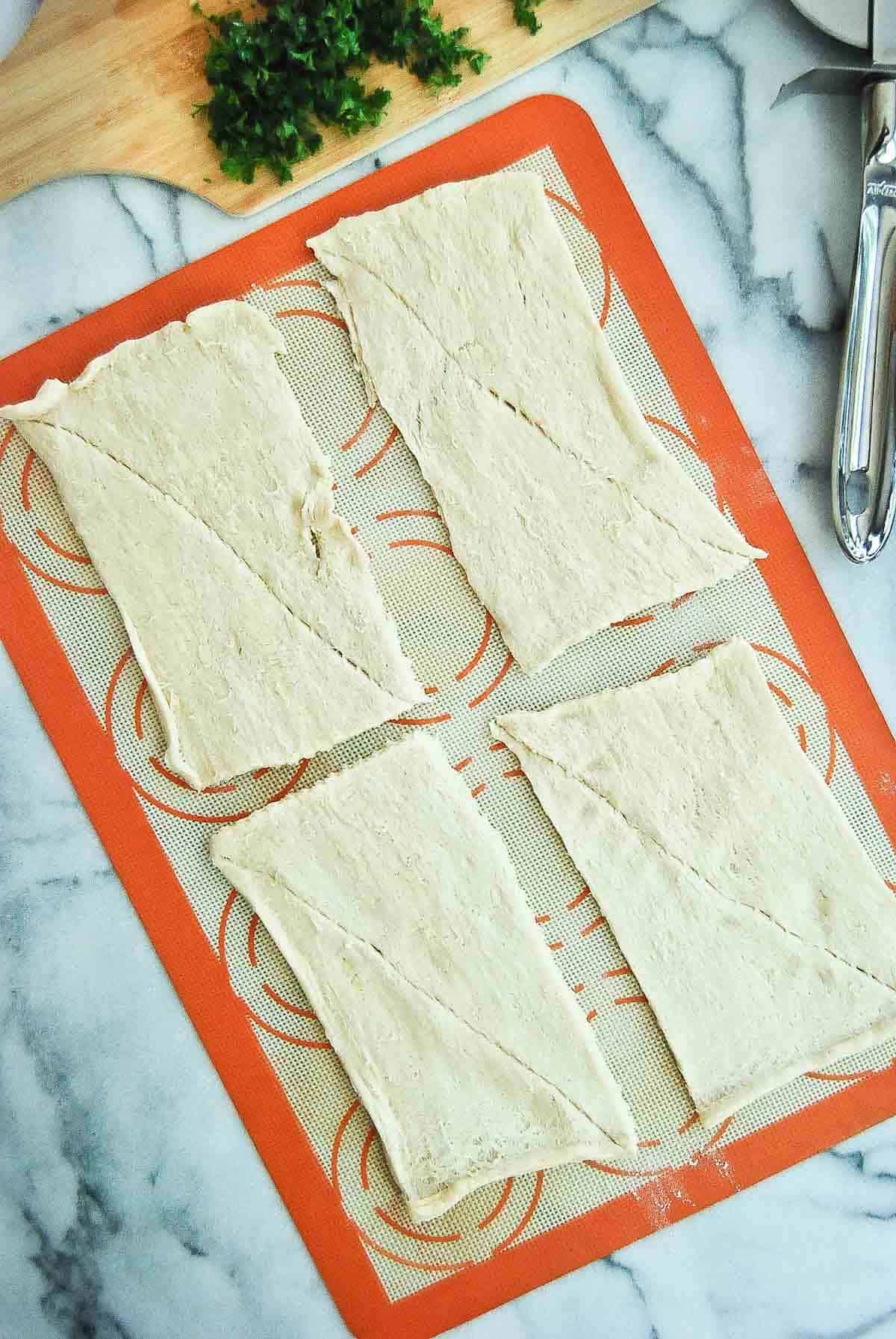 rolled out crescent roll dough into rectangles.