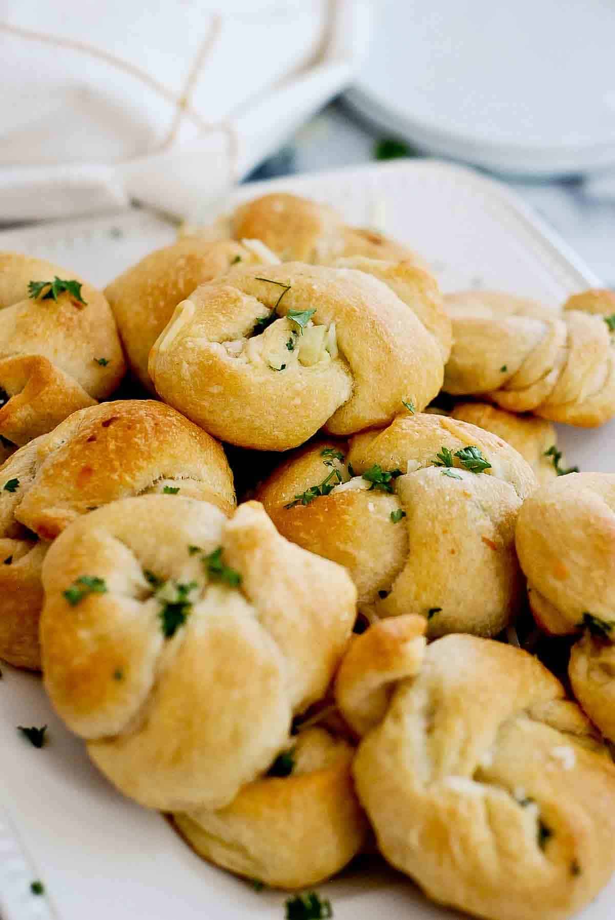 buttery garlic knots on plate.