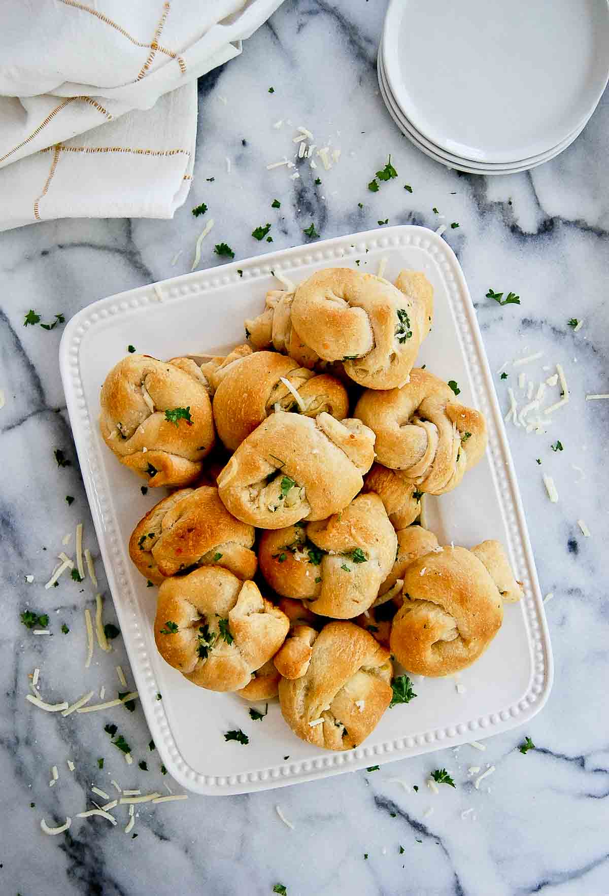 cheesy crescent roll garlic knots on platter.