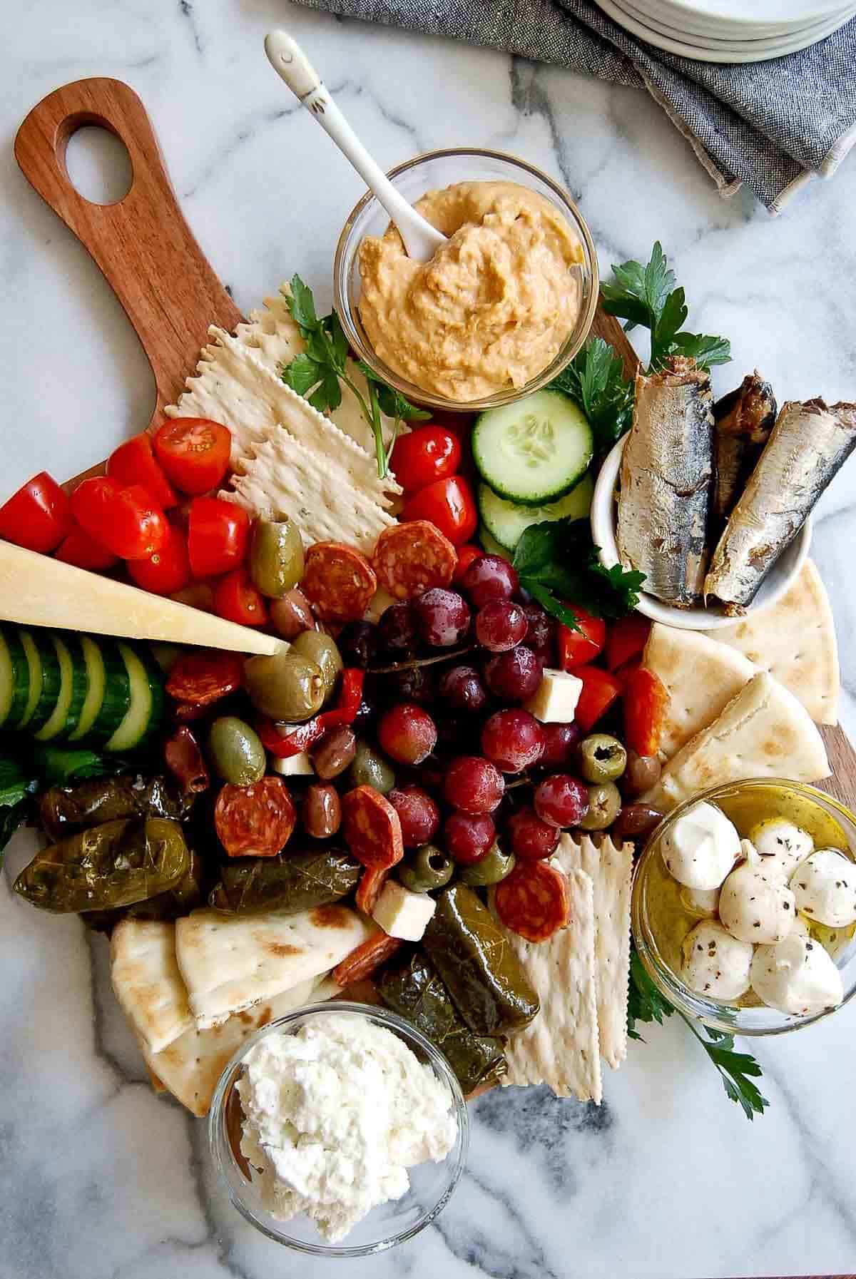 mediterranean charcuterie board on counter.