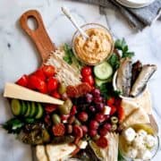 mediterranean charcuterie board on counter.