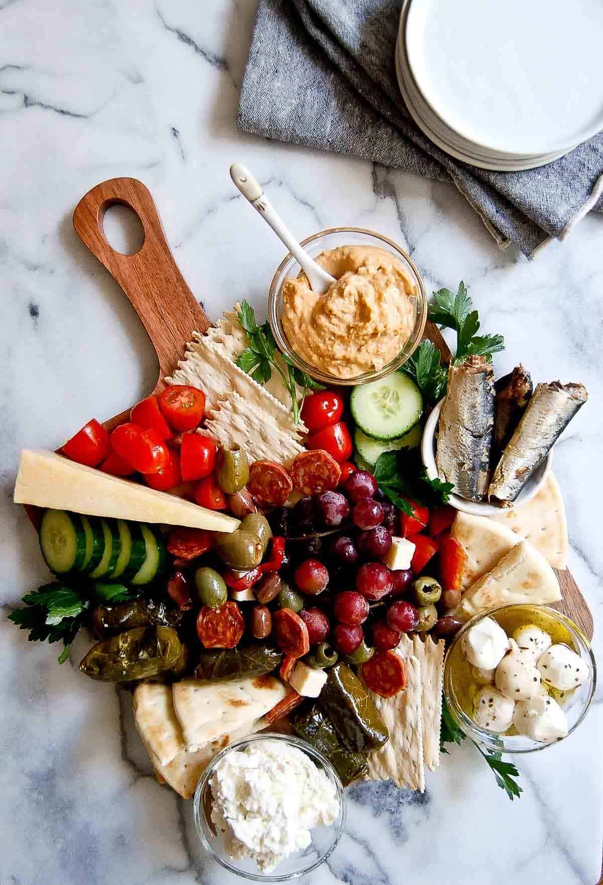 mediterranean charcuterie board on counter.