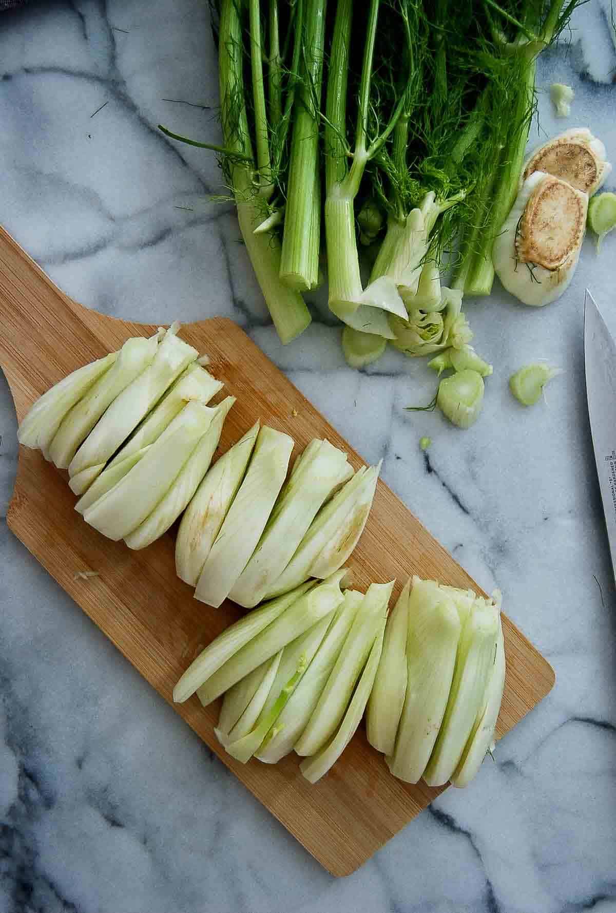 chopped fennel wedges on cutting board.