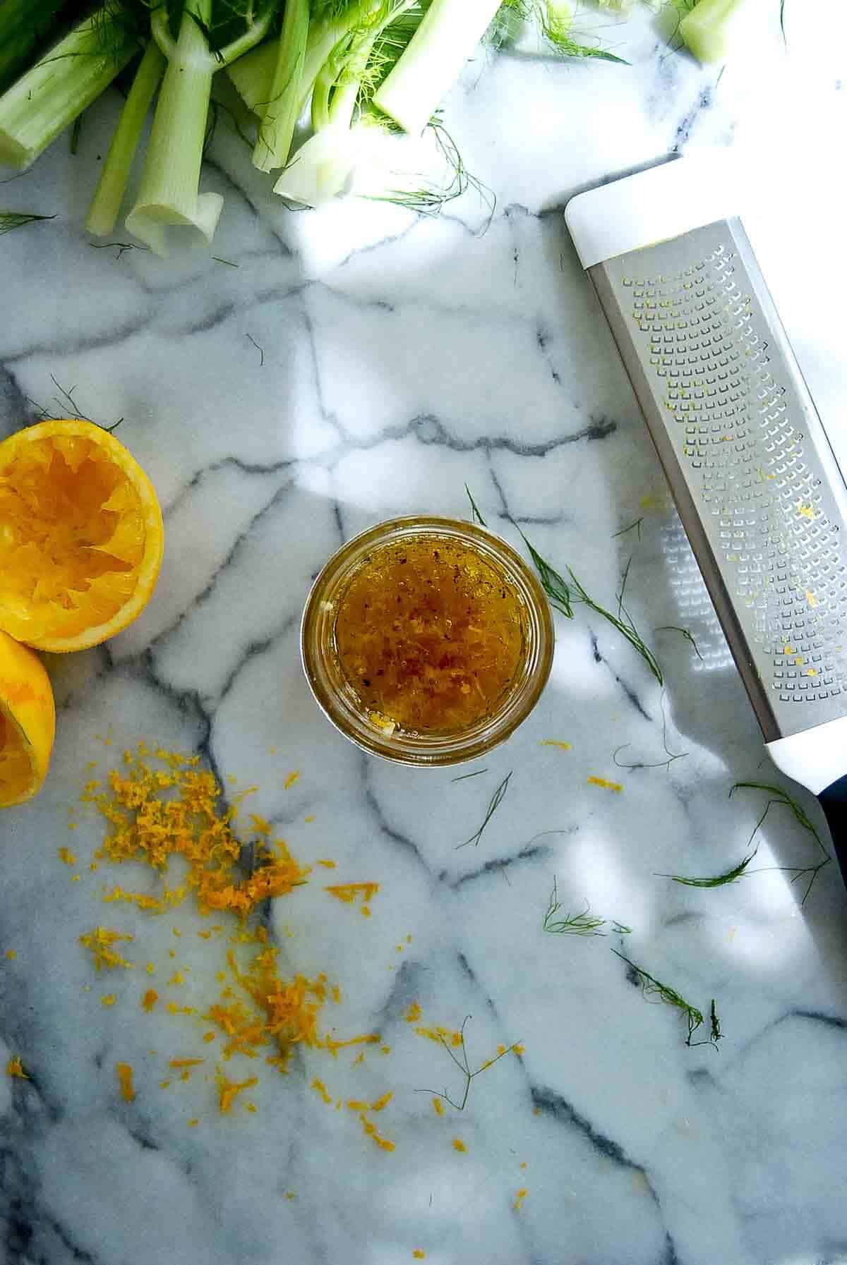 orange honey dressing in jar.