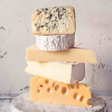 stack of cheeses on cutting board, 27 best american cheese substitutes