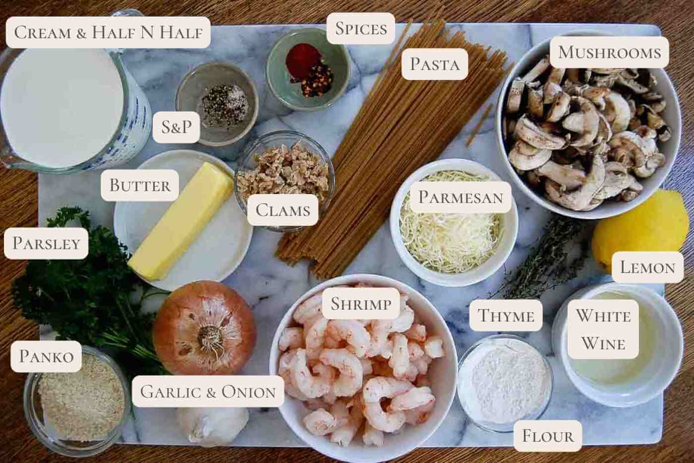 ingredients for seafood tetrazzini on a cutting board.