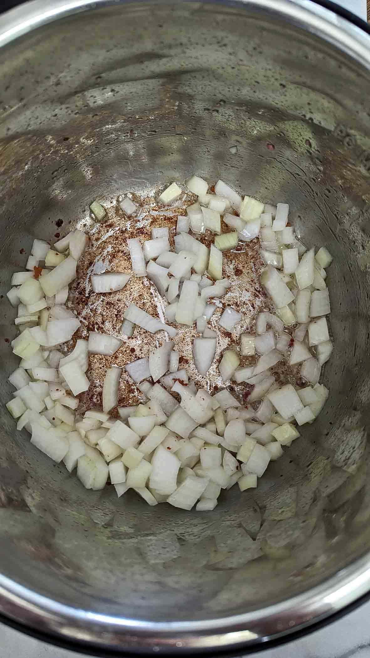 diced onions in crock pot.