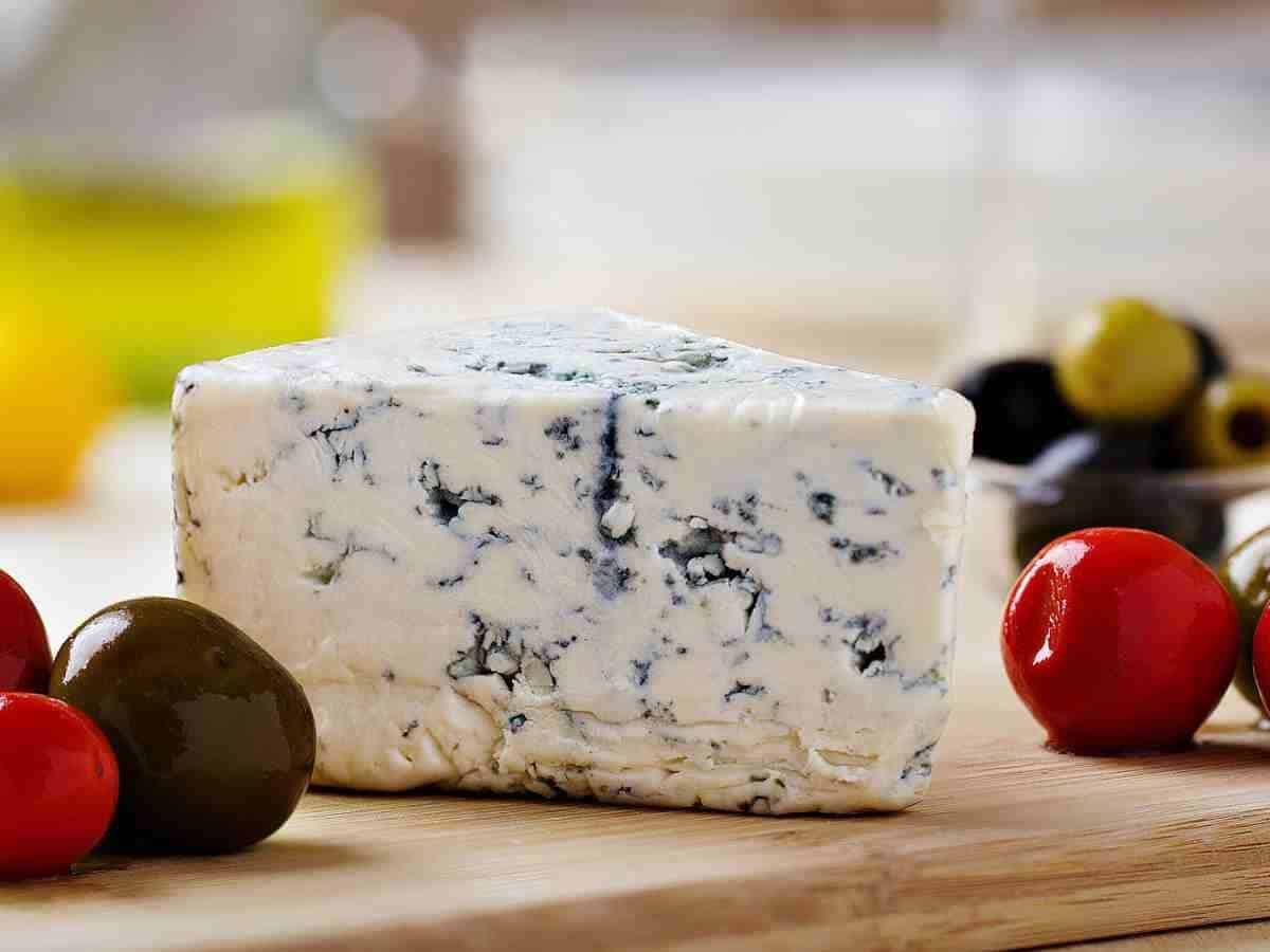 blue cheese on cutting board.