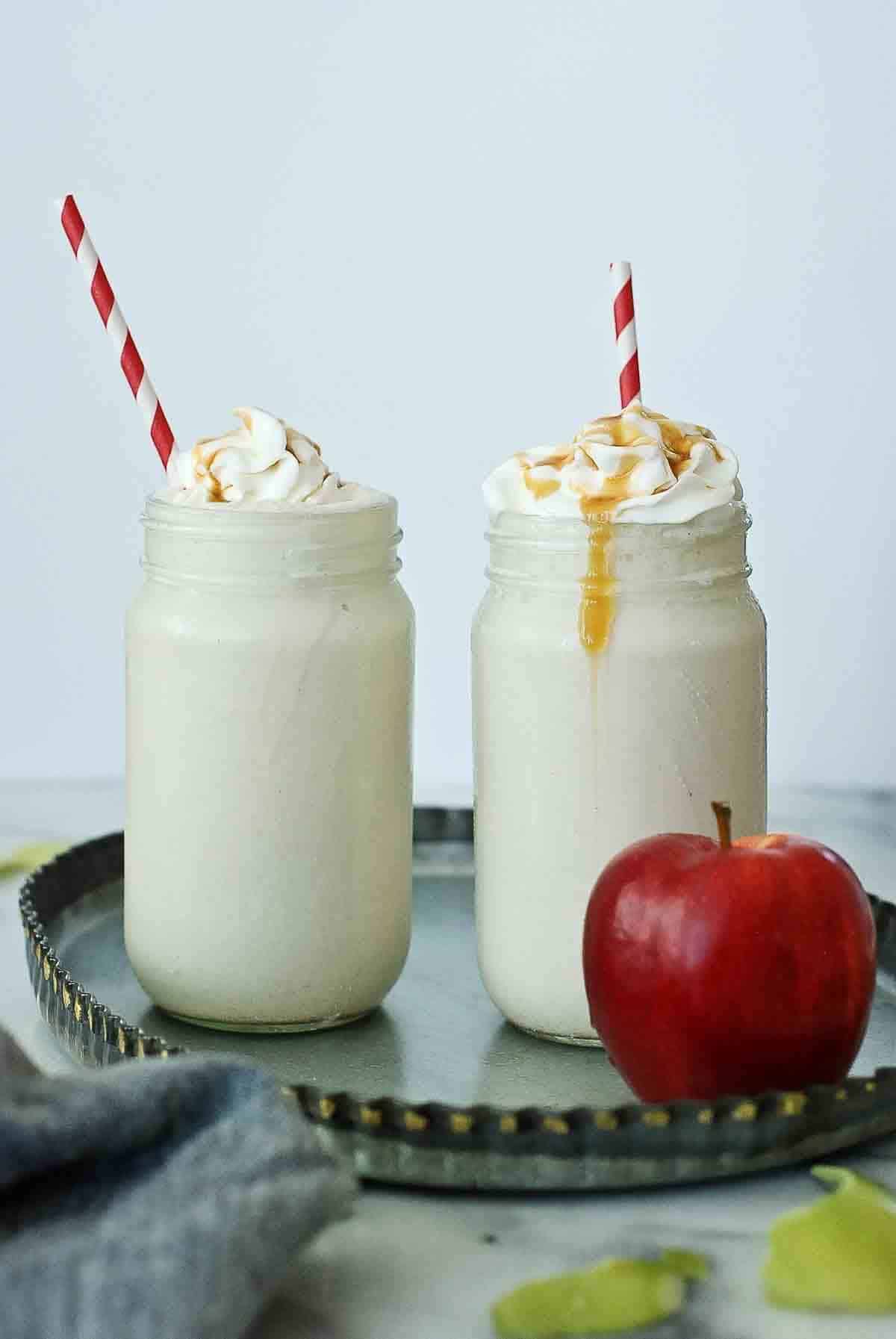 caramel apple frostys on tray with straws.