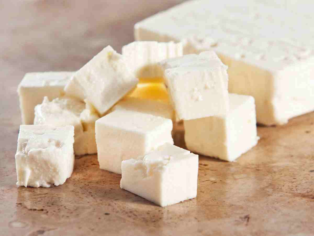 cubed blocks of feta cheese on counter.