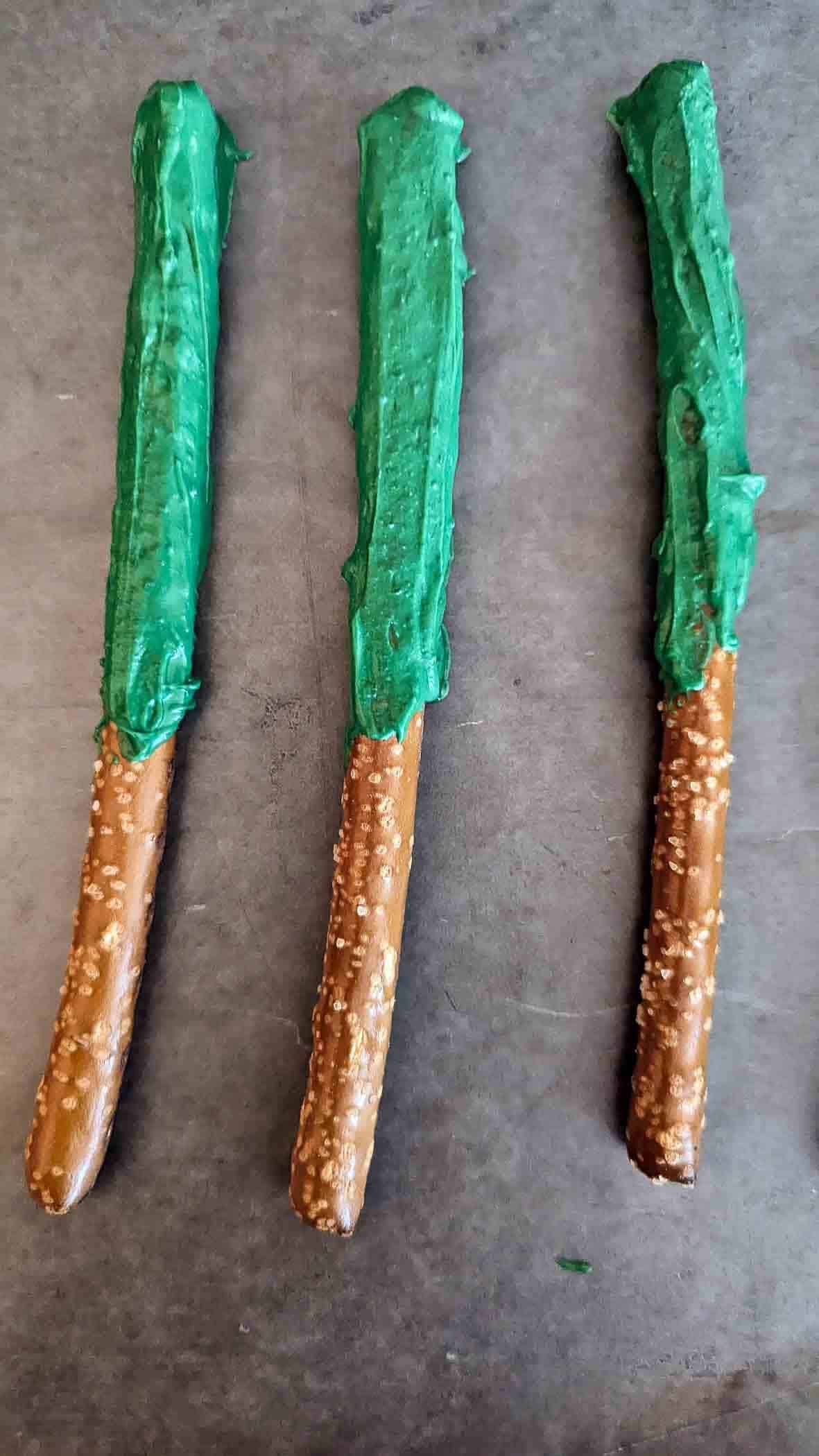 pretzel rods dipped in green chocolate.