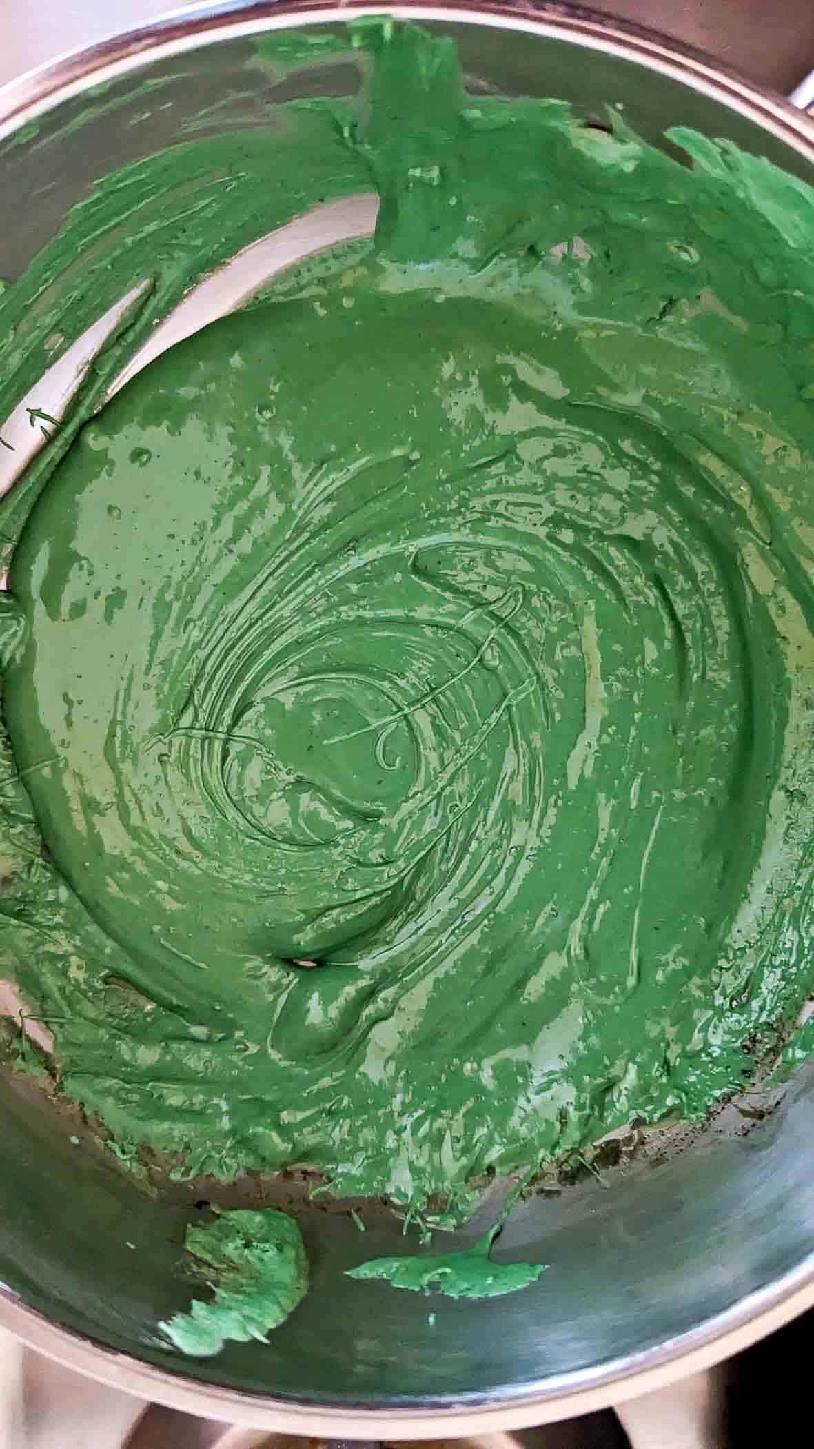 green candy melts, melted in sauce pan.