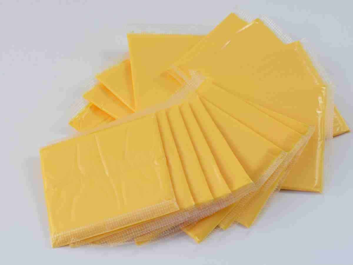 american cheese slices in plastic sleeves.