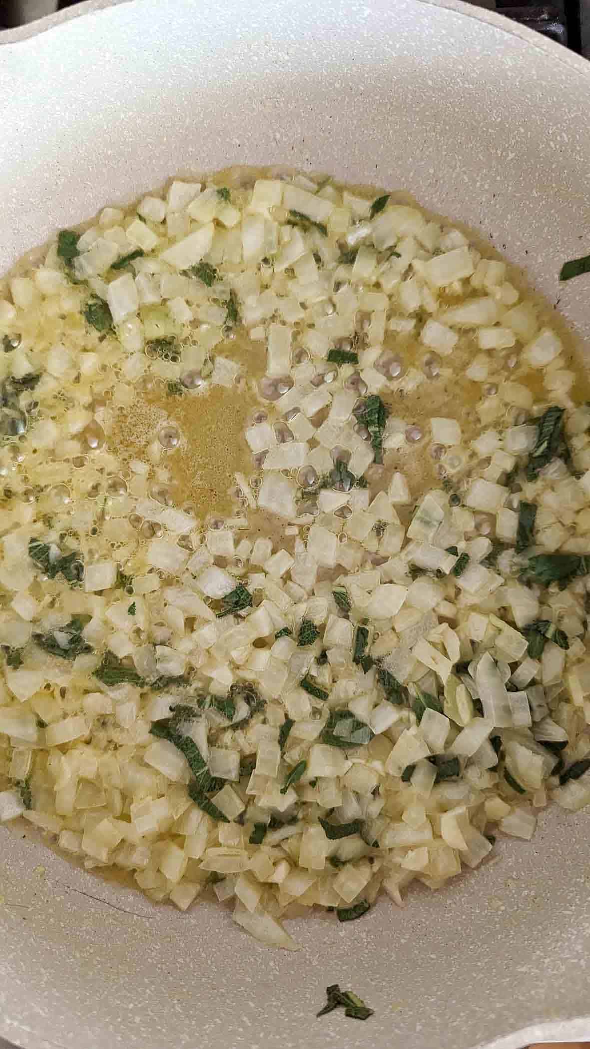 shallots, garlic and sage in butter, sautéing on stove.