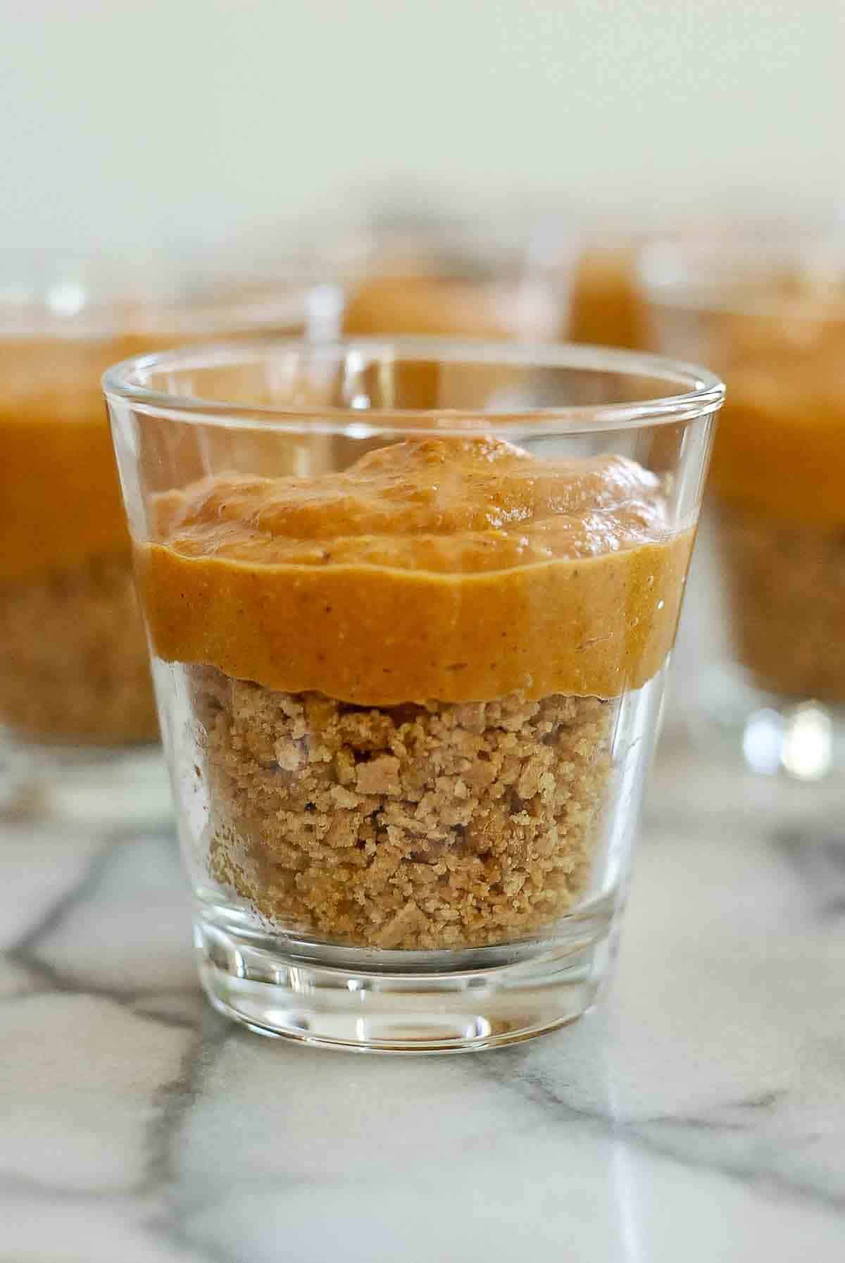 side view of pumpkin pie in a cup.