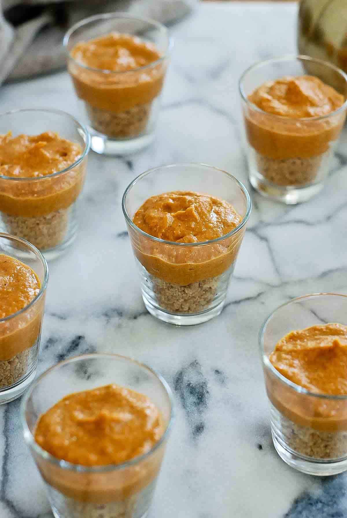 side views of mini cups with pumpkin pie.