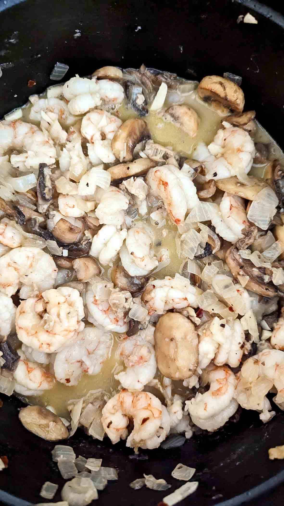 shrimp, clams and white wine sautéing with mushrooms and onions.