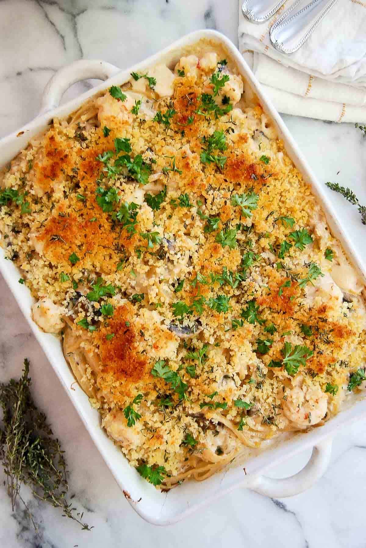 closeup of seafood tetrazzini on cutting board with buttery panko topping.