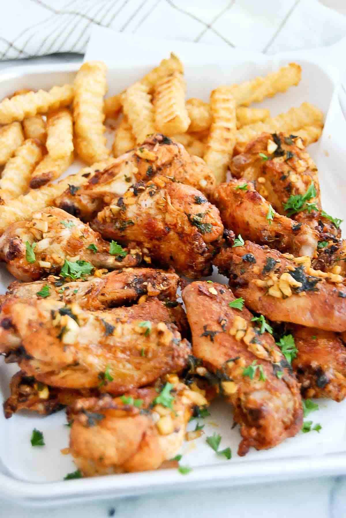 side view of spanish chicken wings on tray.