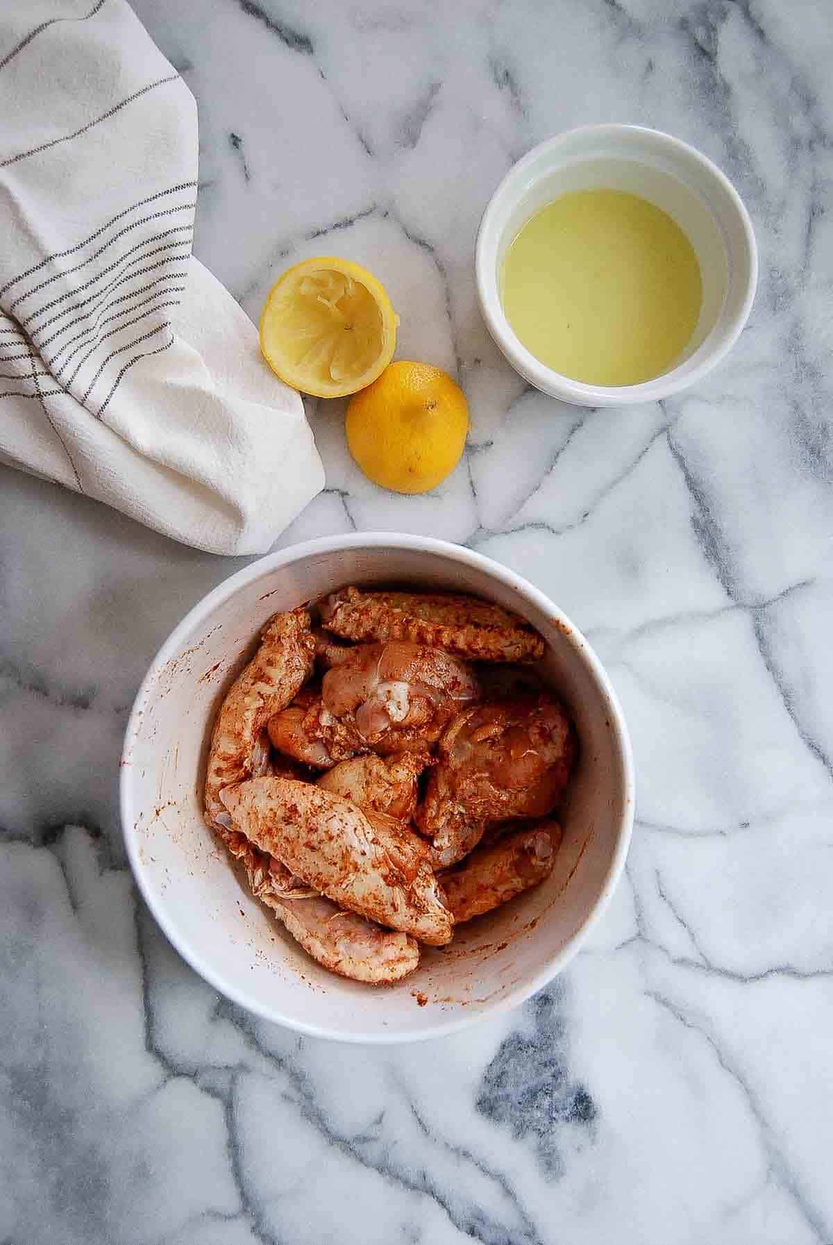 marinated spanish chicken wings in bowl.