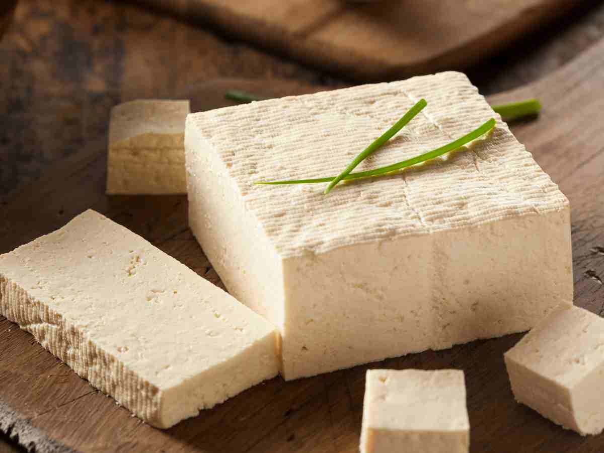 block of tofu on cutting board.