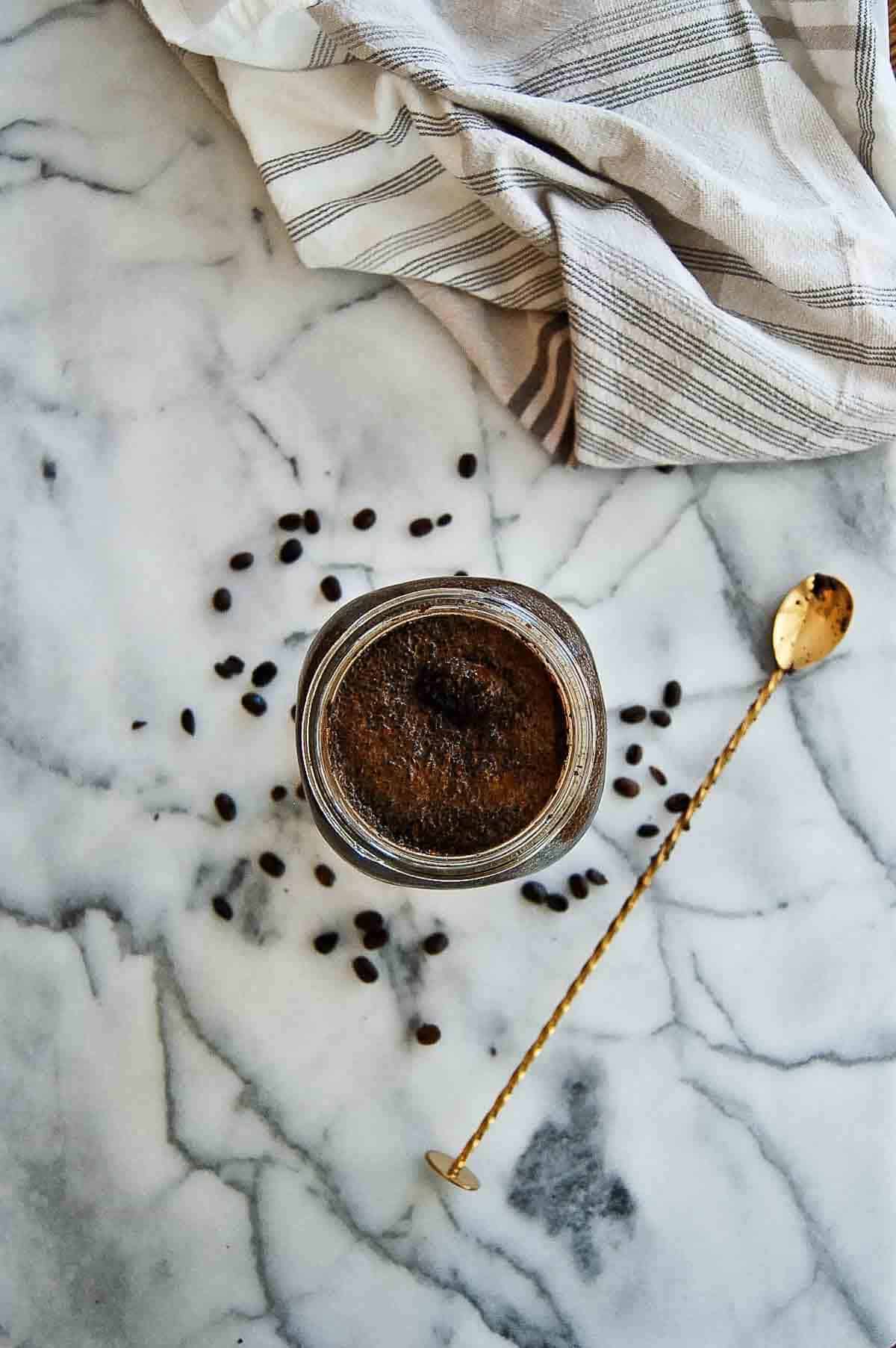 coffee grounds mixed with mason jar.