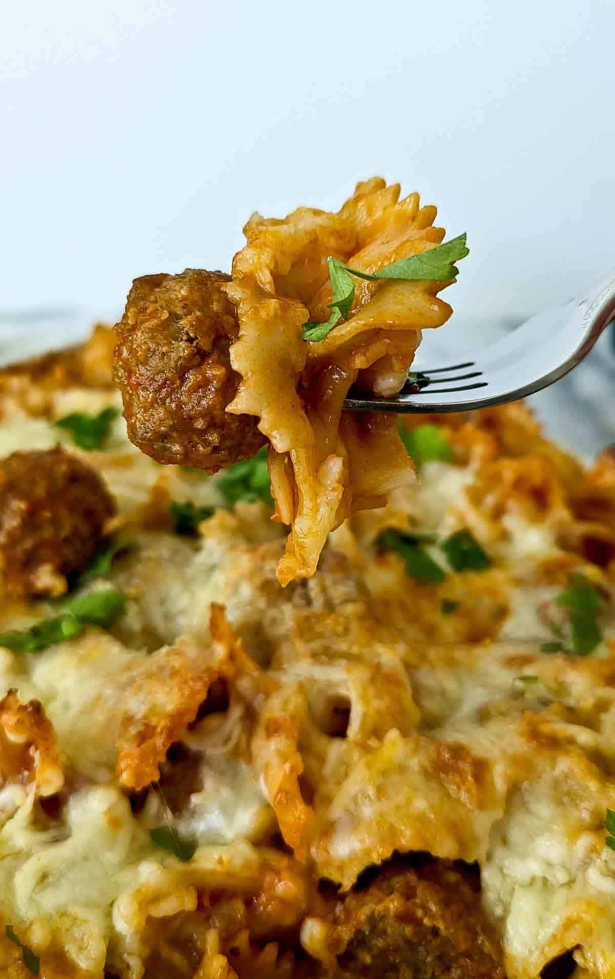 forkful of dump and bake meatball casserole.