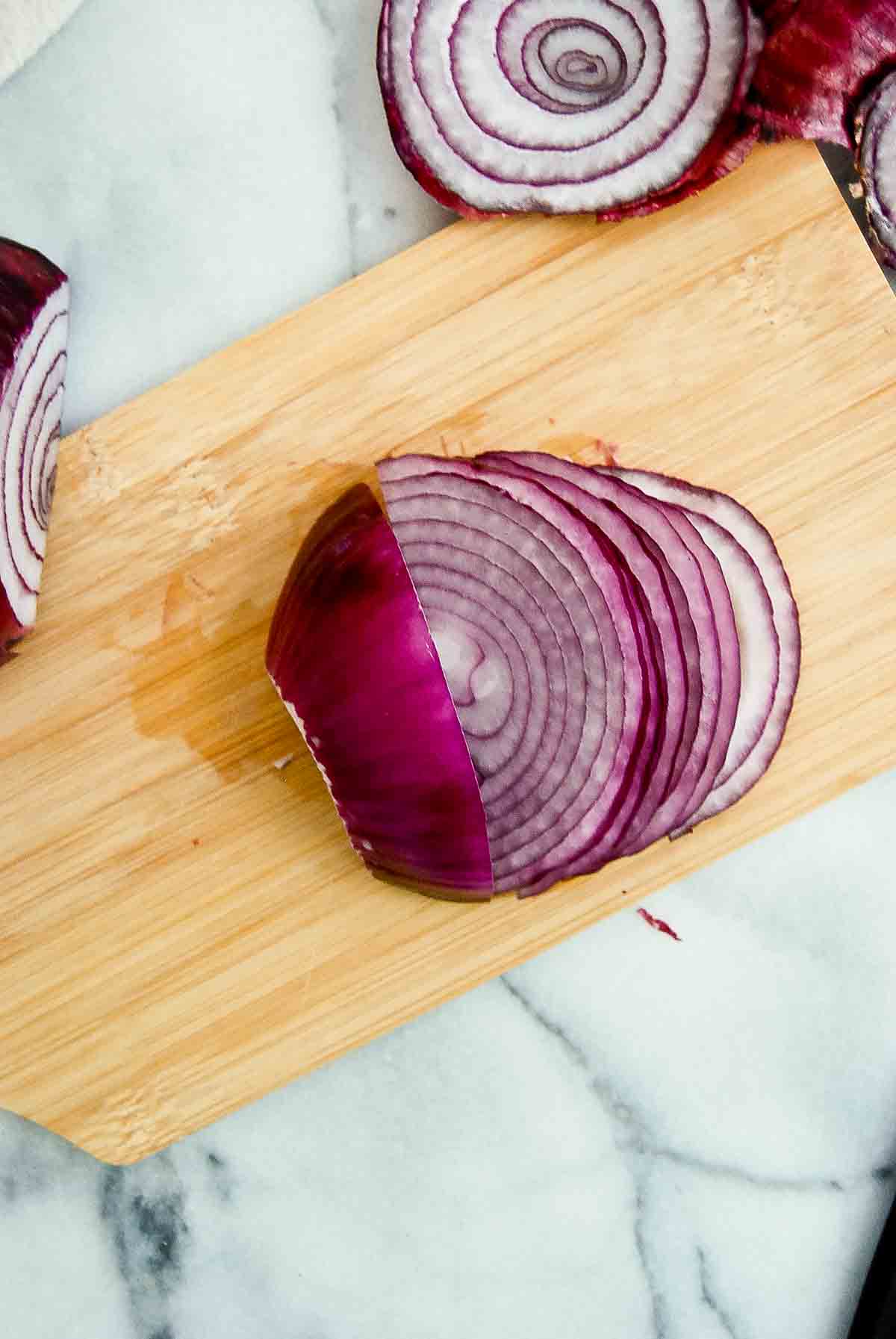 1 part of sliced onion on cutting board.