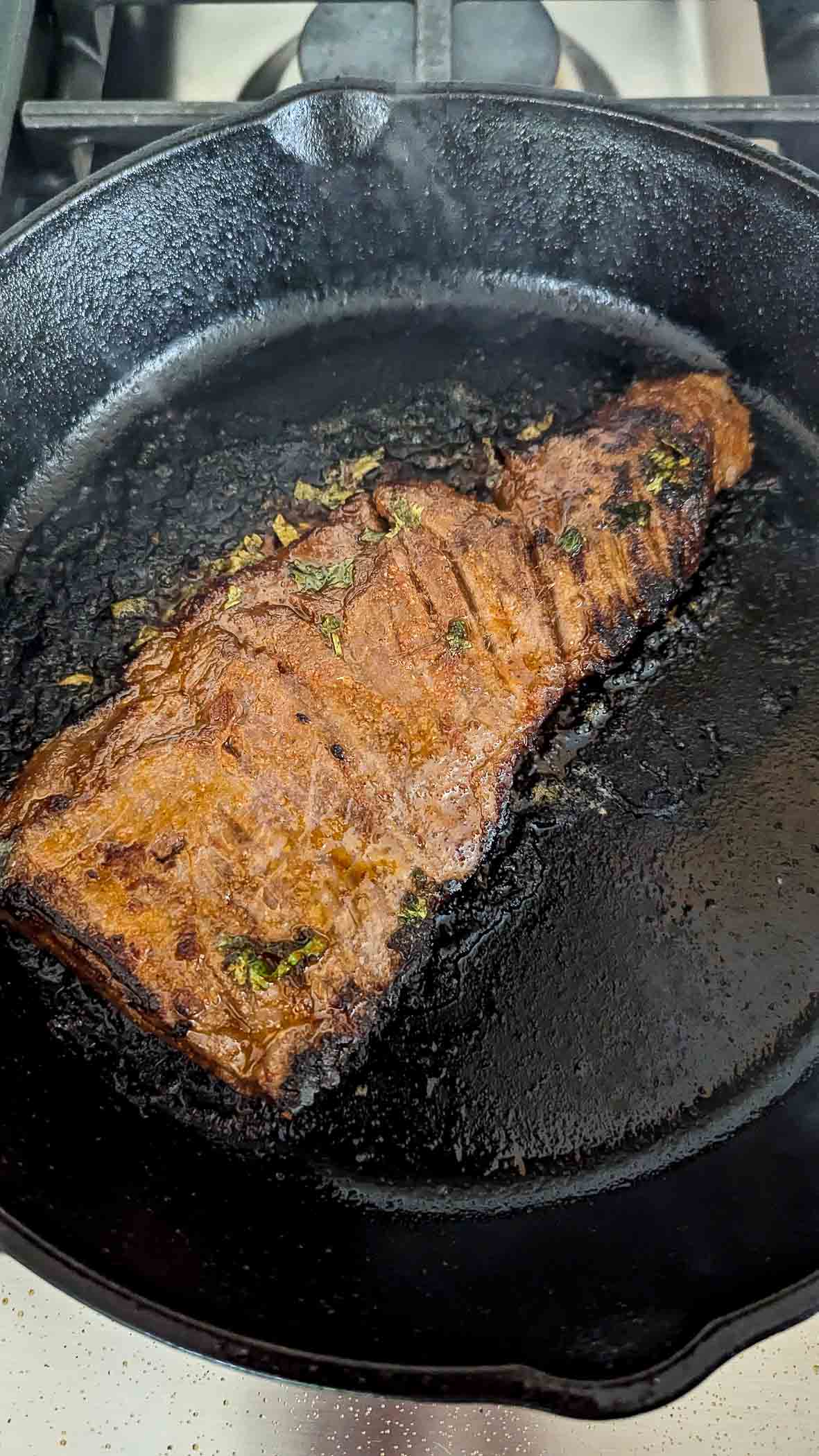 skirt steak in pan.