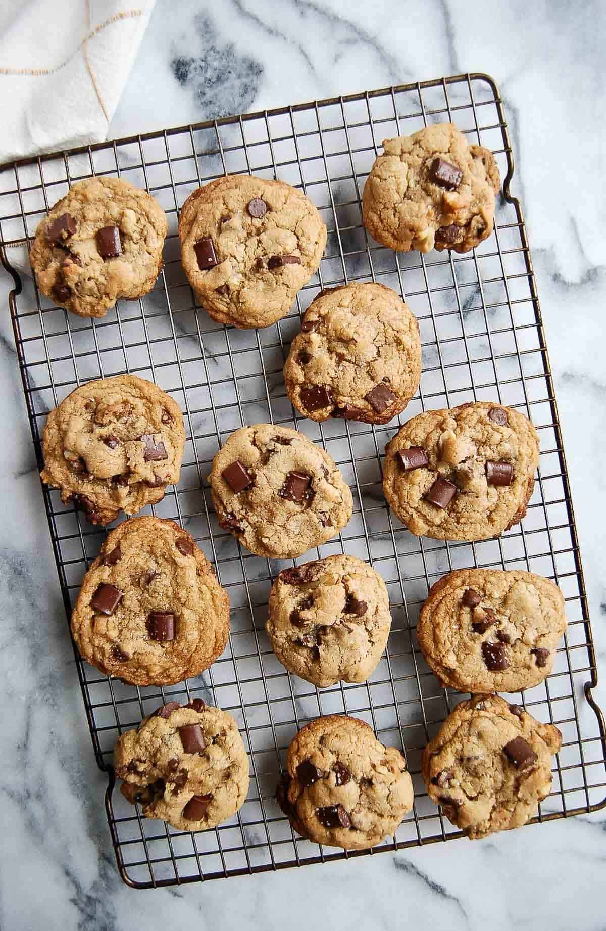 chocolate chip walnut cookies on wire rack.