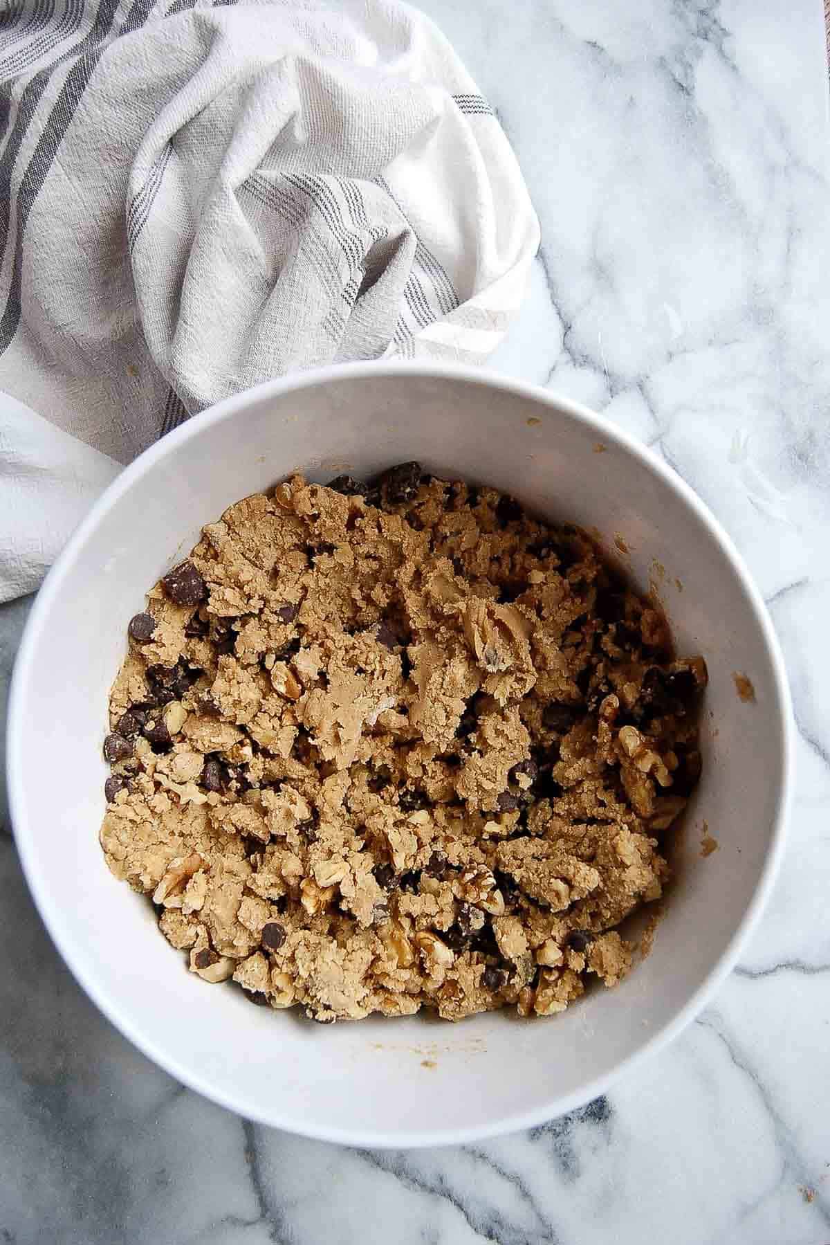 chocolate chip walnut cookie dough in bowl.