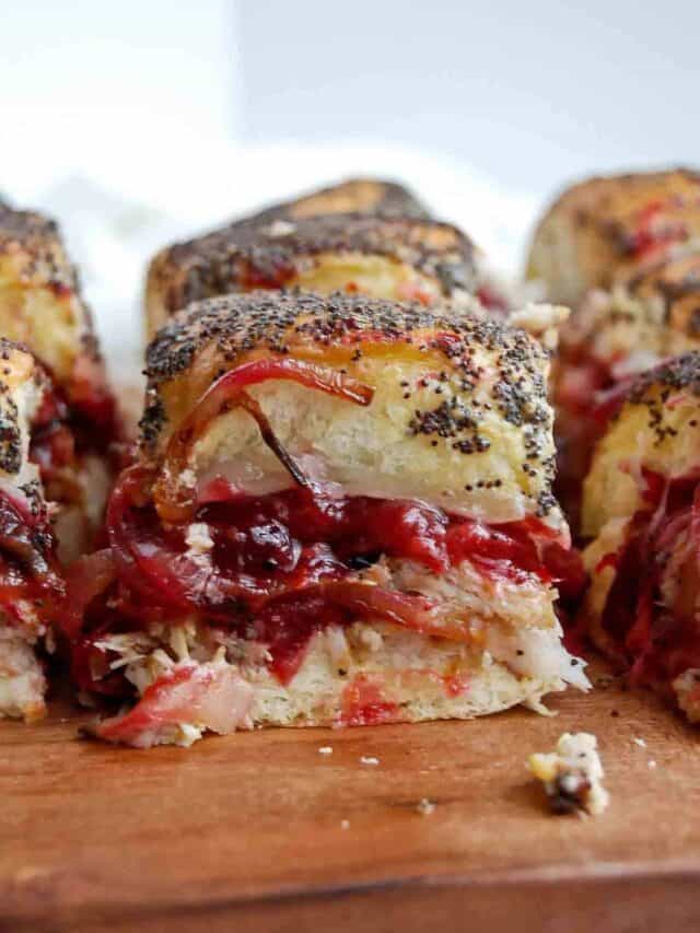 closeup view of turkey cranberry slider on cutting board.