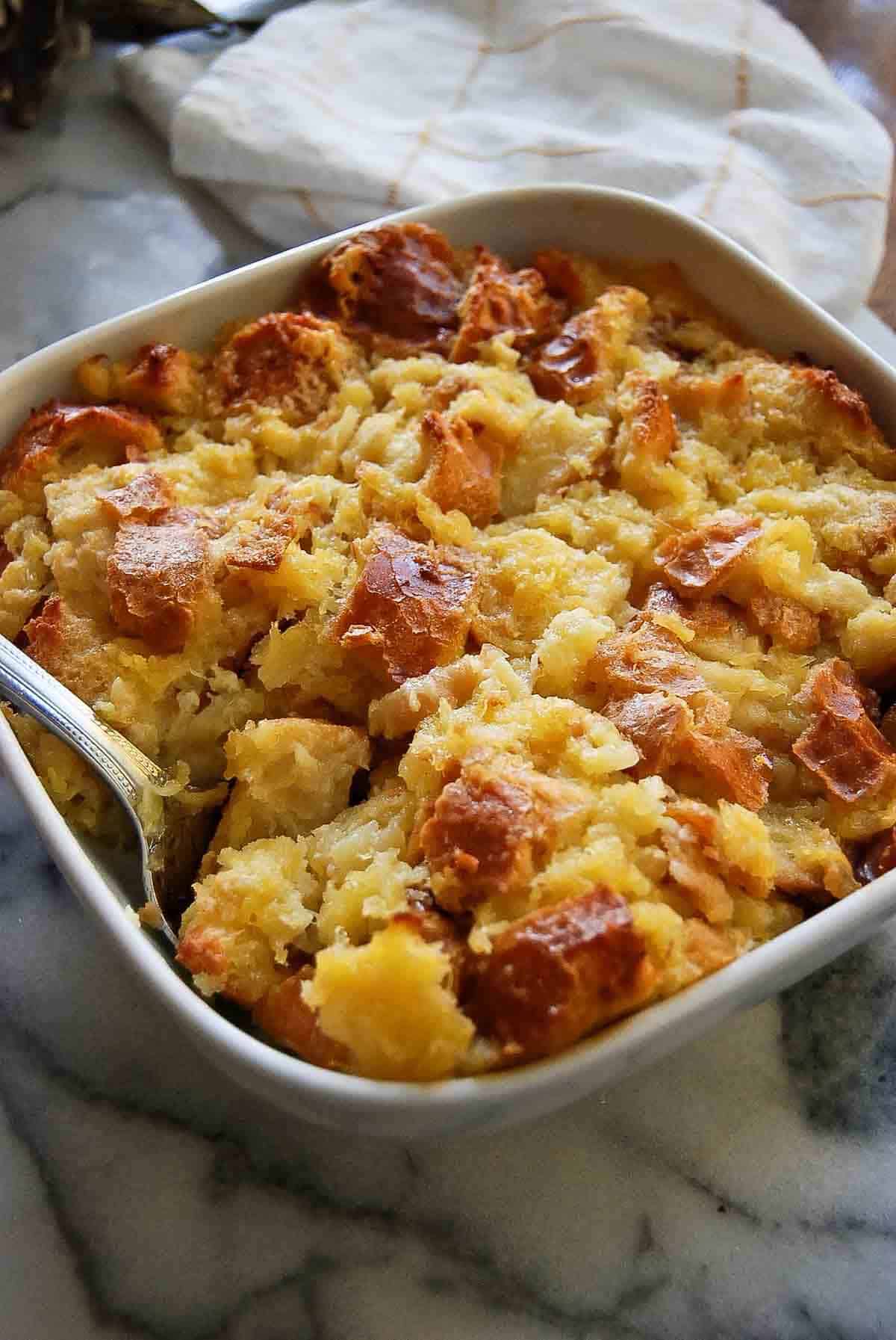 side view of scalloped pineapple in baking dish.