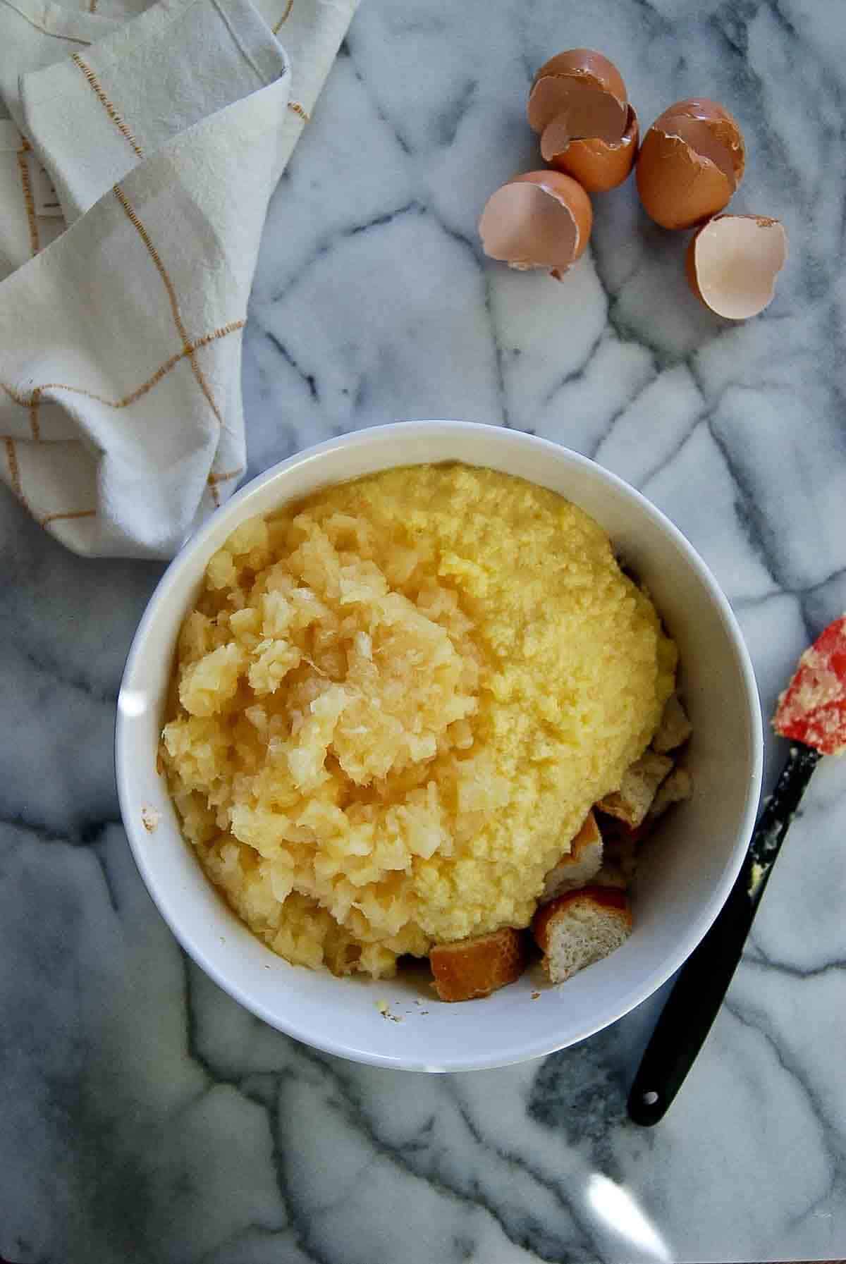 butter mixture, bread and canned pineapple in bowl.