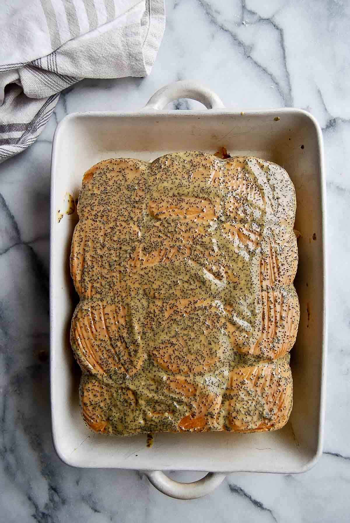 butter poppy seed mixture spread over the top of the sliders.