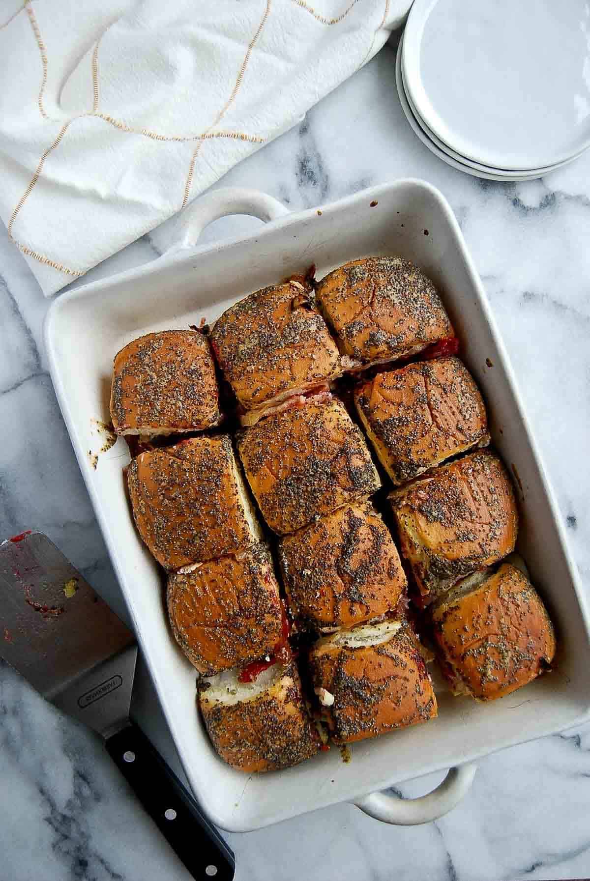 individually cut turkey cranberry sliders in baking dish.