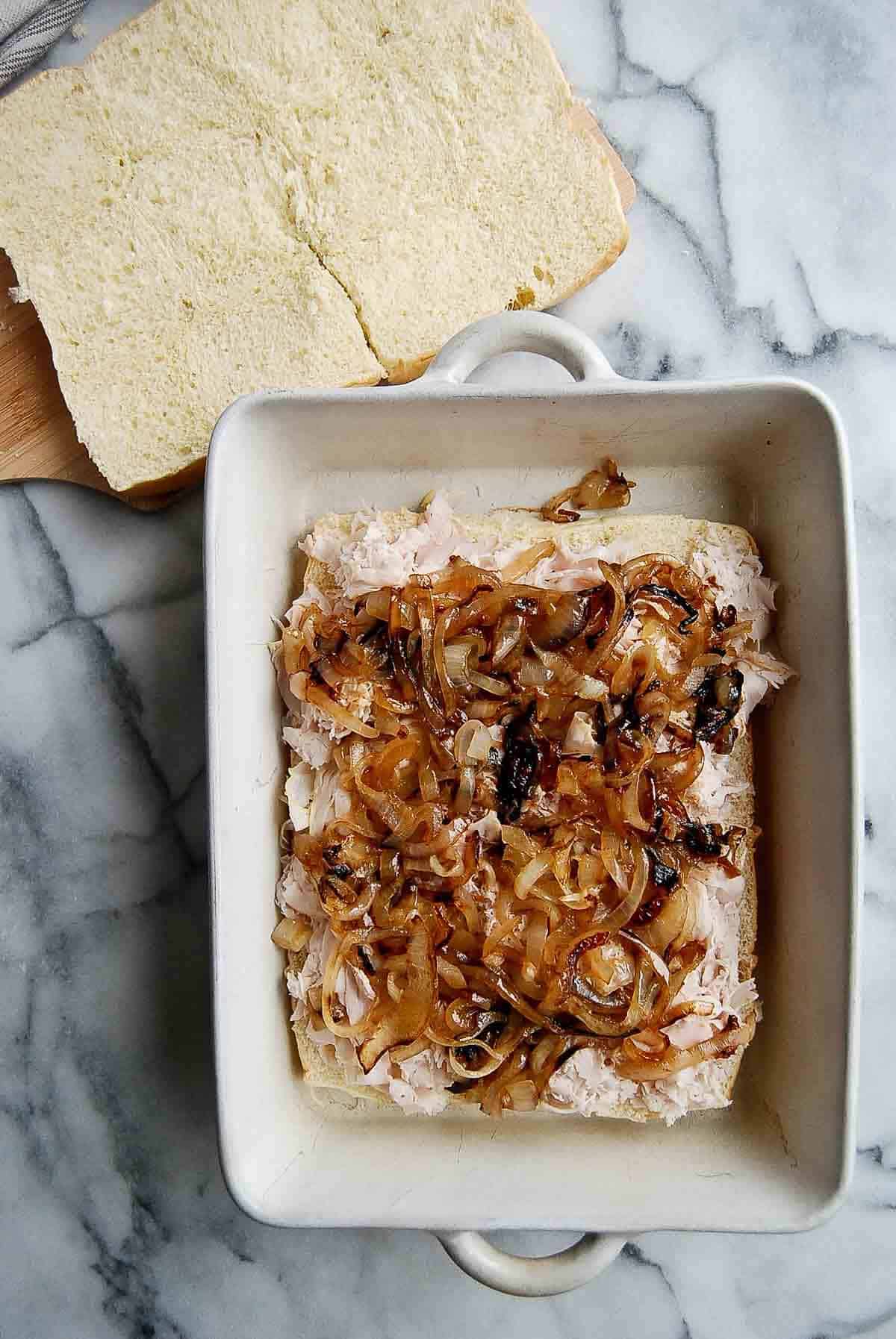 rolls with turkey and caramelized onions added to the top.