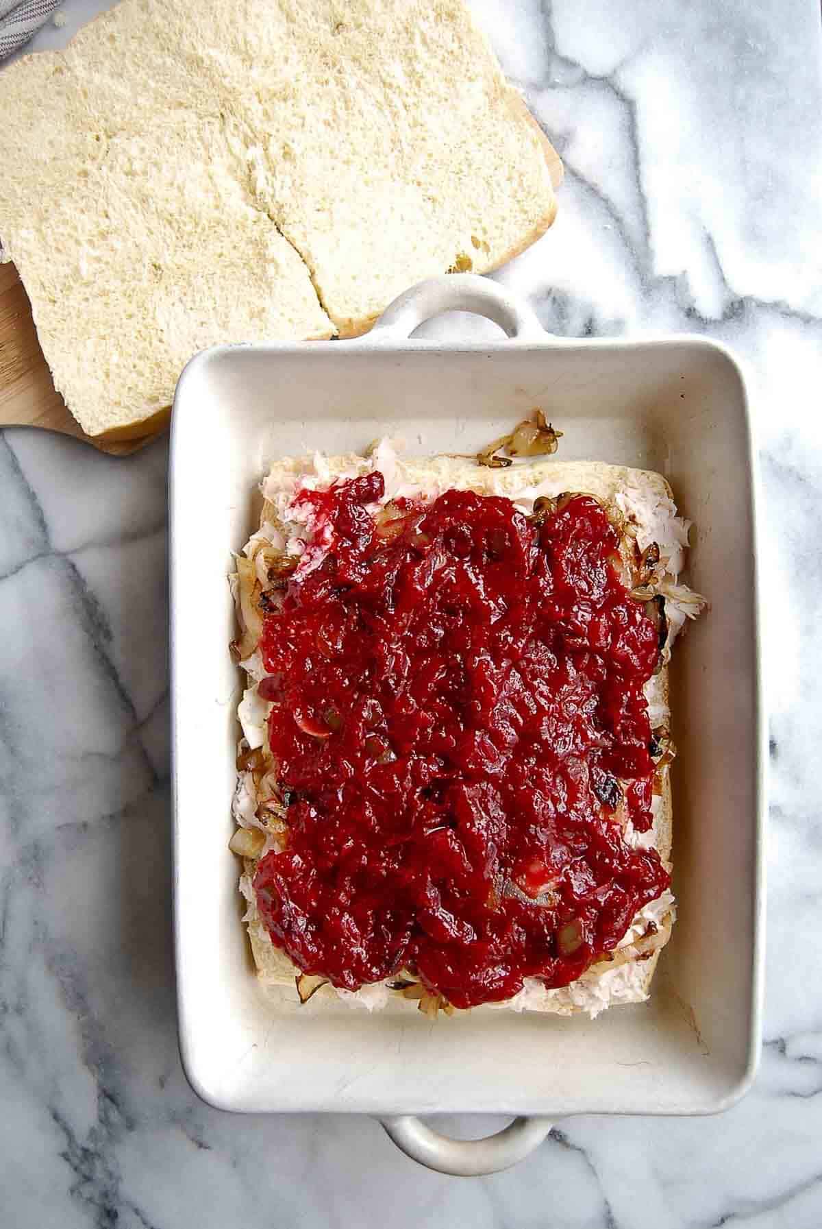 rolls with turkey, caramelized onions and cranberry sauce added to the top.