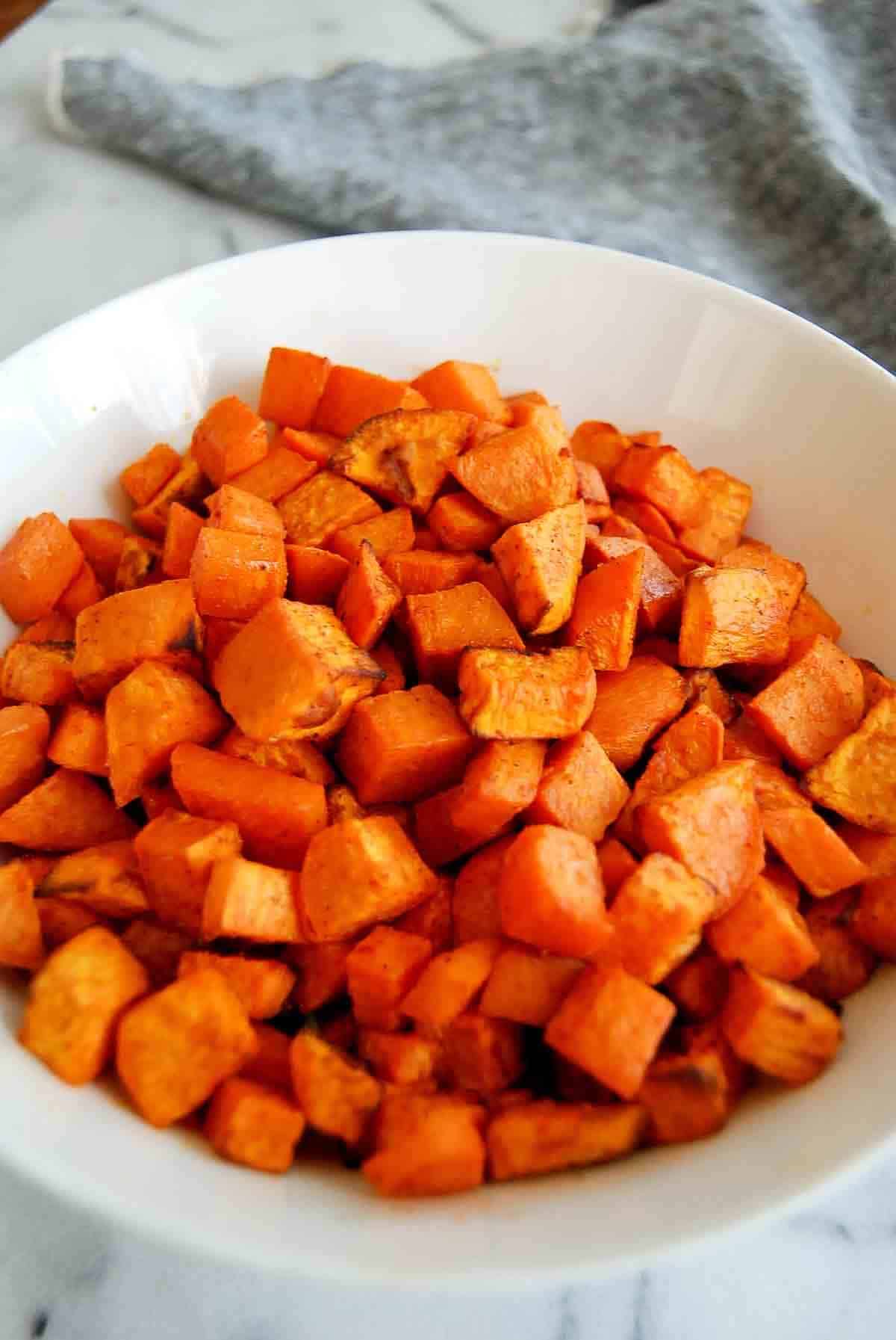 side view of air fryer roasted sweet potato cubes.