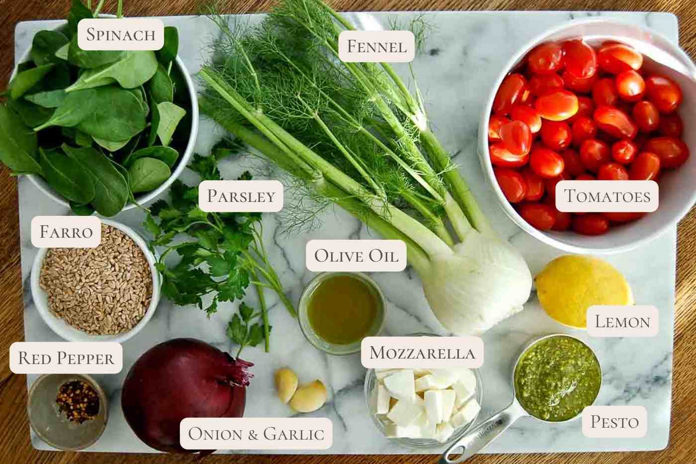 ingredients for farro with blistered tomato and farro on countertop.