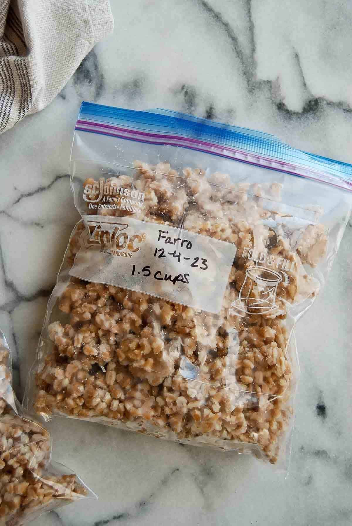 bag of frozen cooked farro, labeled.