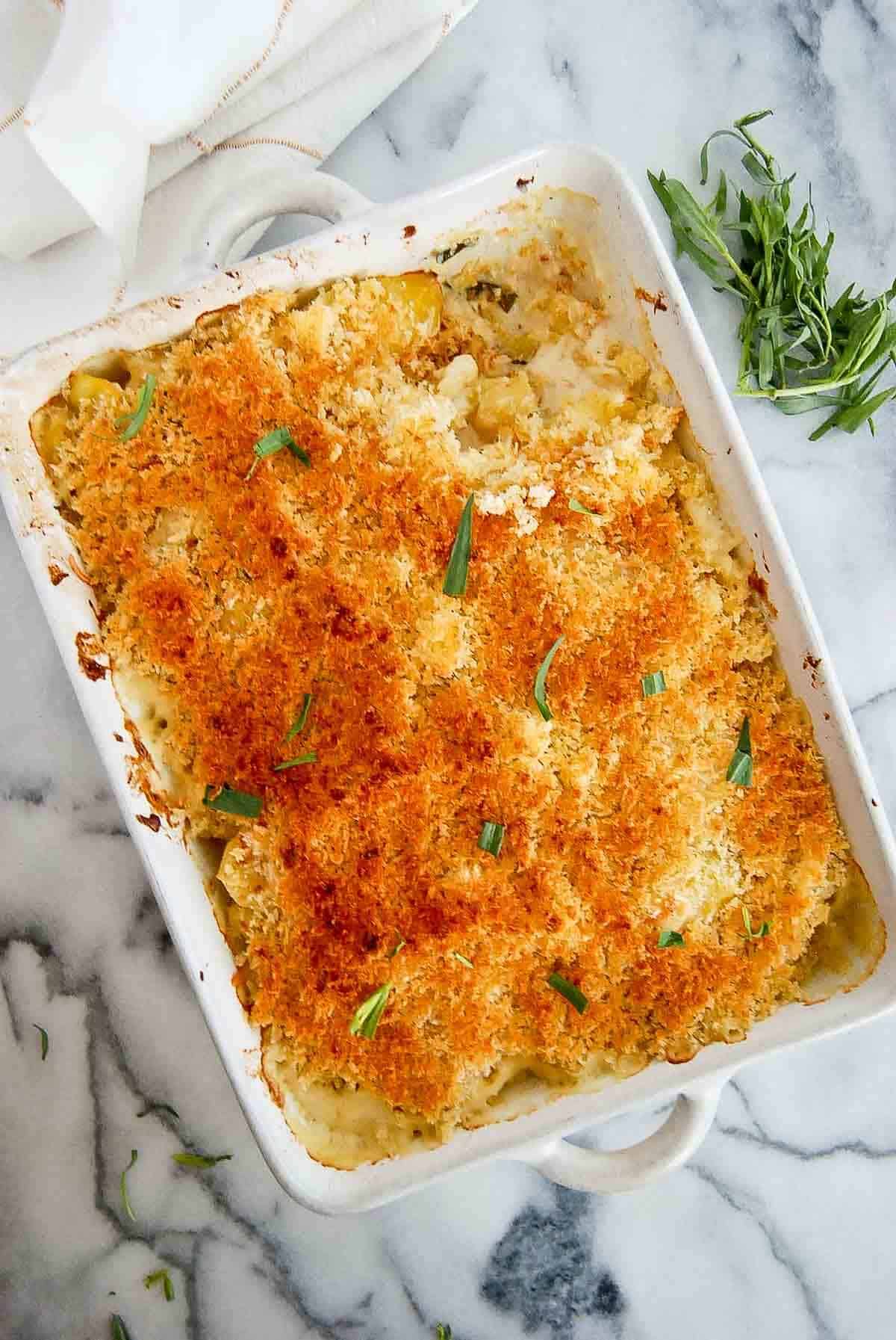 easy instant pot scalloped potatoes in baking dish with serving removed.