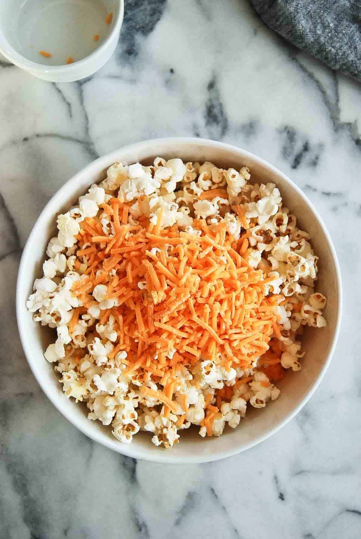 popcorn with cheddar cheese on top.