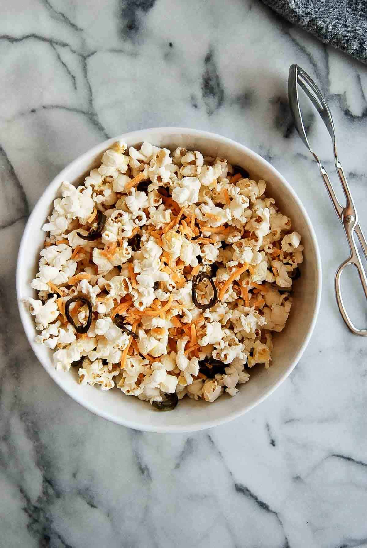 jalapeno cheddar popcorn in bowl on countertop.