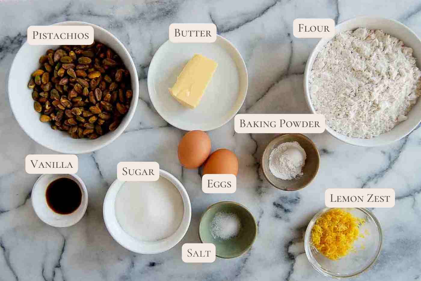 ingredients for lemon biscotti recipe with pistachio and lemon glaze.