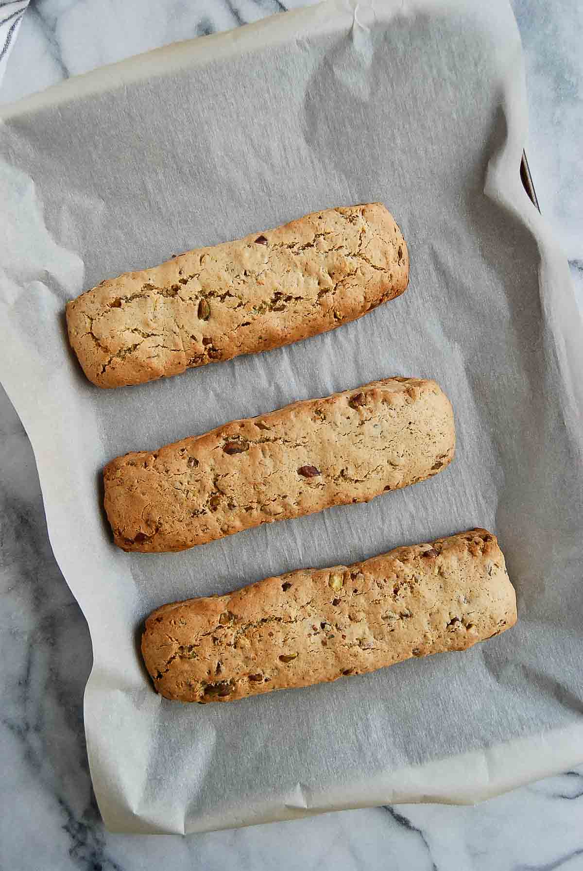 baked lemon biscotti loaves with pistachios.