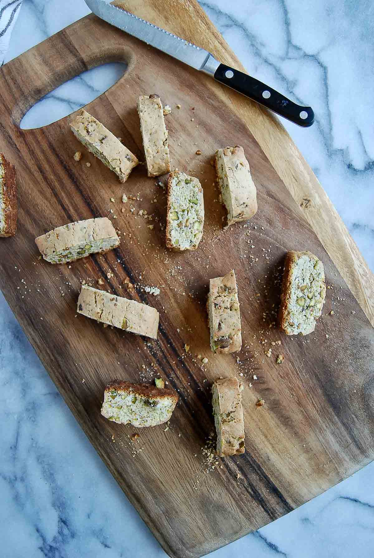 sliced lemon biscotti cookies on cutting board.