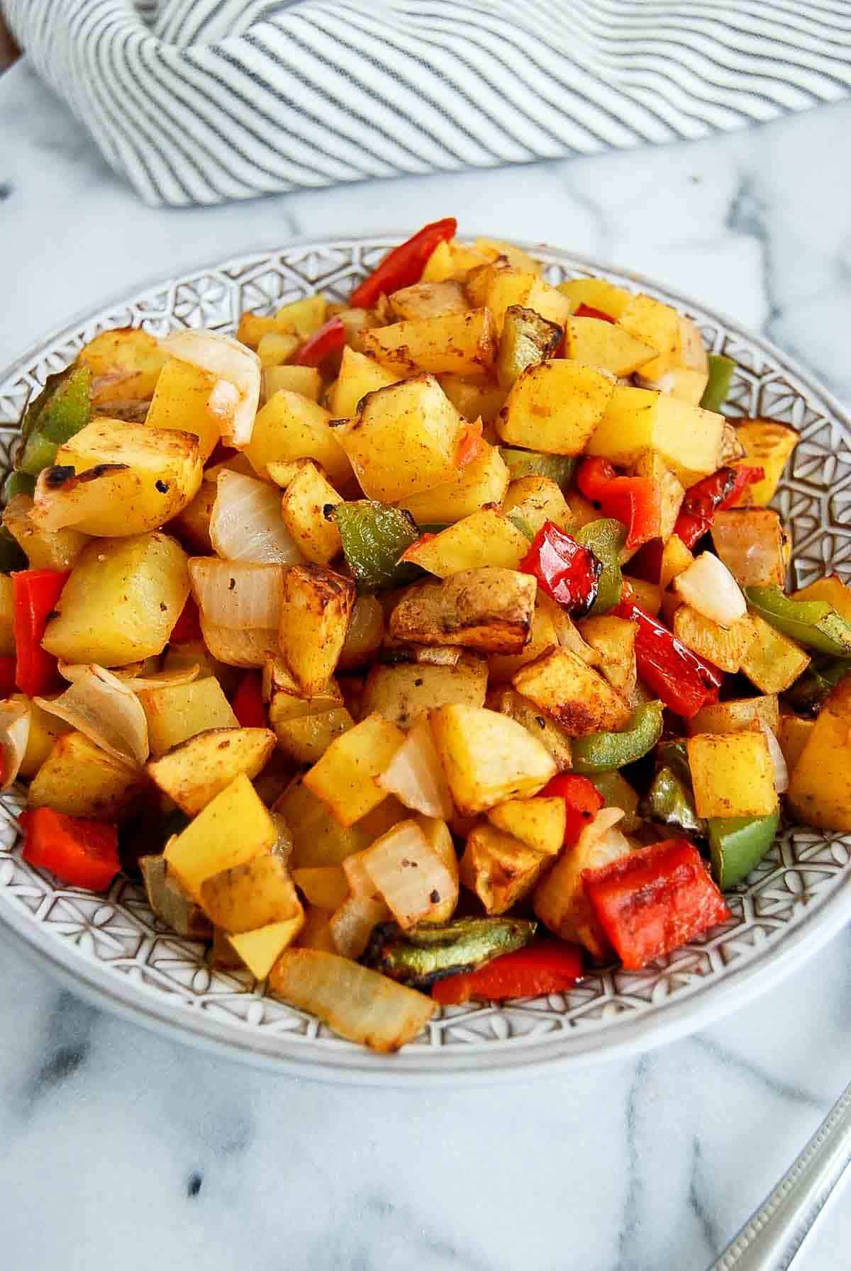 side view of air fryer breakfast potatoes.